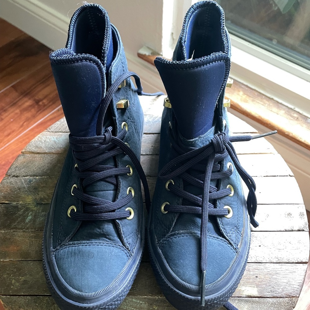 Dark navy leather high top converse